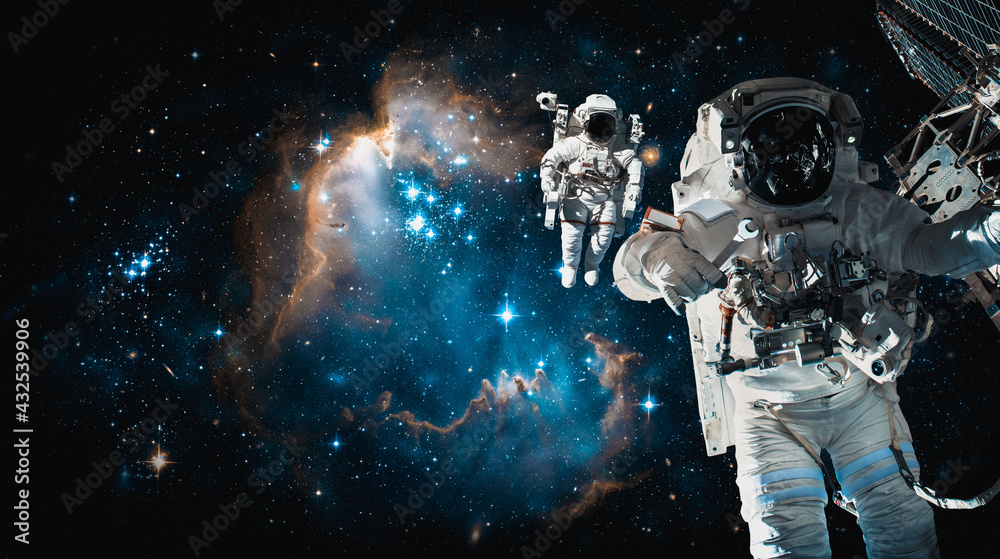 Wall mural astronaut spaceman do spacewalk while working for space station in outer space . astronaut wear full