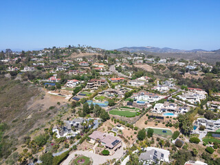 Fototapeta na wymiar Aerial view off massive expensive mansions in the valley of Carlsbad, North County San Diego, California, USA.