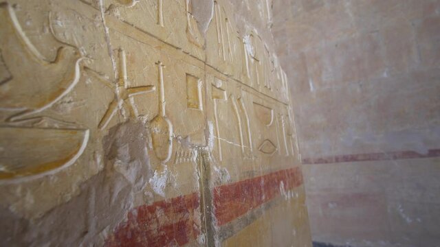 Bird hieroglyph in Mortuary Temple of Hatshepsut and fresco wall paint around temple