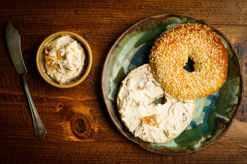 Sourdough sesame seed bagel with honey walnut fig cream cheese