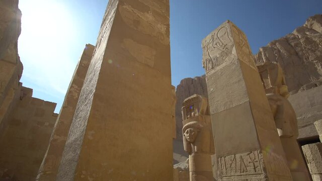 Hathor god on architecture columns ruins in hatshepsut temple Luxor Egypt