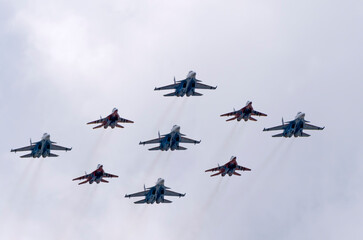 MOSCOW, RUSSIA - MAY 7, 2021: Avia parade in Moscow. group jet fighter aircraft MiG-35 and Su-30 in...
