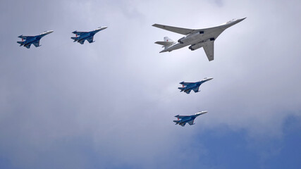 MOSCOW, RUSSIA - MAY 7, 2021: Avia parade in Moscow. su-35 and strategic bomber and missile...