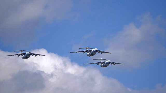 MOSCOW, RUSSIA - MAY 7, 2021: Avia parade in Moscow. 3 Ilyushin Il-76 multi-purpose four-engined strategic airlifters fly in the sky on parade of Victory in World War II in Moscow, Russia