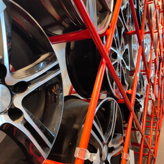 automotive alloy aluminum alloy wheels on the stand of the car dealership
