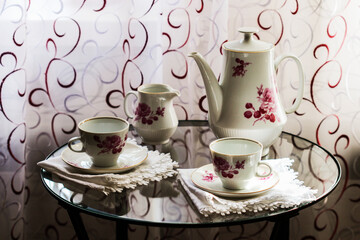 Tea set on a glass table
