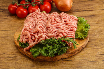 Raw pork minced meat over board
