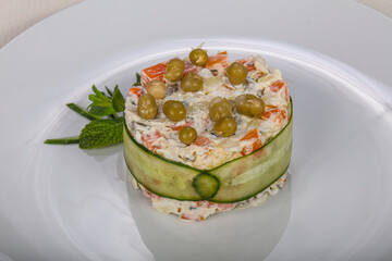 Traditional Russian salad Olivier with meat