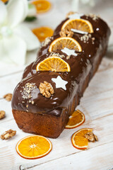Home Made Panettone. Traditional Italian sweet bread. Panettone with a slice served on a wooden table.