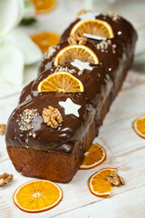 Home Made Panettone. Traditional Italian sweet bread. Panettone with a slice served on a wooden table.