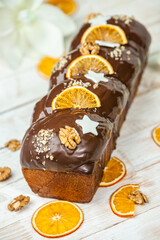 Home Made Panettone. Traditional Italian sweet bread. Panettone with a slice served on a wooden table.