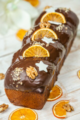 Home Made Panettone. Traditional Italian sweet bread. Panettone with a slice served on a wooden table.