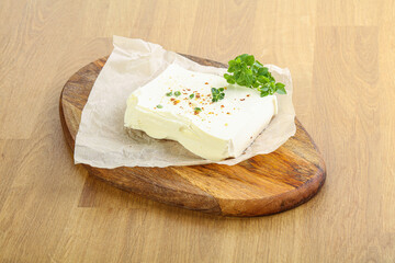 Greek Feta cheese over board