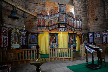 Fototapeta na wymiar ZAPORIZHIA, UKRAINE - MARCH 24, 2019: Wooden church interior. Wooden building on Zaporozhye Sich in Ukraine. Medieval church on island of Khortitsa in Zaporozhye.