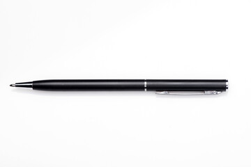 Ballpoint pen on a white background, black metal pen.