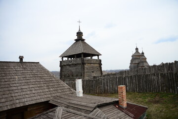 Fototapeta na wymiar Wooden church. Wooden building on Zaporozhye Sich in Ukraine. Medieval church on island of Khortitsa in Zaporozhye