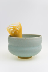 Japanese green tea matcha Chasen bamboo whisk and traditionally Japanese bowl isolated in white background.
