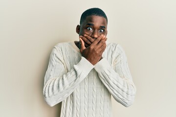 Young african american man wearing casual clothes shocked covering mouth with hands for mistake. secret concept.