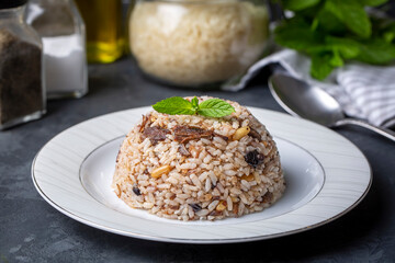 Traditional delicious Turkish food; rice pilaf with pine nuts and currants (Turkish name; ic pilav...