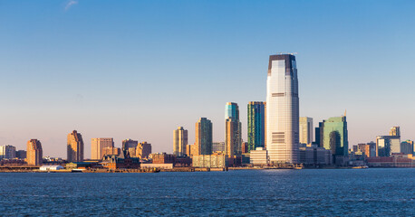 Fototapeta premium Jersey City, New Jersey, skyline from across New York Harbor.