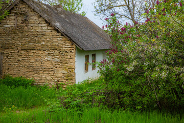 Fototapeta na wymiar landscape with old, forgotten house, abandoned somewhere in the villages of Moldova. Abandoned house in Republic of Moldova. Depopulation concept.