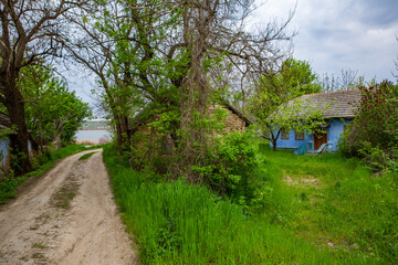 landscape with old, forgotten house, abandoned somewhere in the villages of Moldova. Abandoned house in Republic of Moldova. Depopulation concept.
