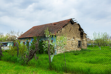 Obraz premium landscape with old, forgotten house, abandoned somewhere in the villages of Moldova. Abandoned house in Republic of Moldova. Depopulation concept.