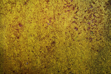 Grunge concrete with damaged paint. This is a double exposure picture of a dirty red painted concrete wall and a yellow one