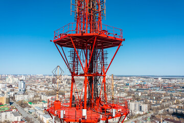 4G TV radio tower with parabolic antenna and satellite dish. Broadcast network signal. High...