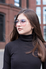 portrait of a woman wearing sunglasses. Businesswoman