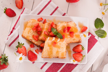 Lemon pund cake with honey and fresh strawberries.