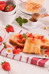 Lemon pund cake with honey and fresh strawberries.