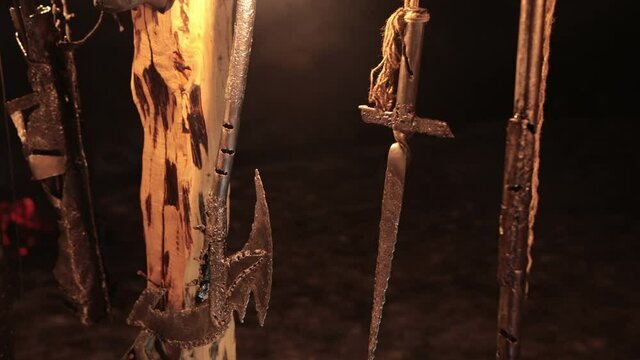 Battle armor, blades viking knives. Pedestal for fighting between opponents, ritual place of ancient vikings with torches, ring. Night, low light.