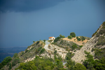 The ancient Greek chapel is located at the top of the mountain.