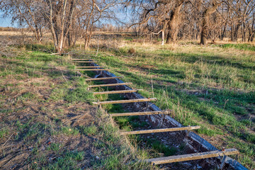 Remains of old metal flume used to transport slurry of mostly lime, beet pulp, and water from the...