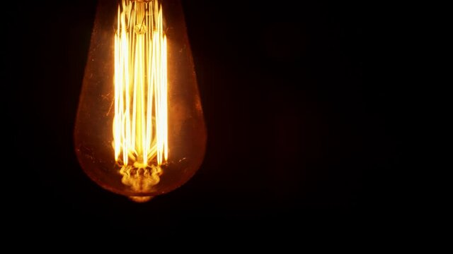 The light turns off. Edison light bulb reproduction.