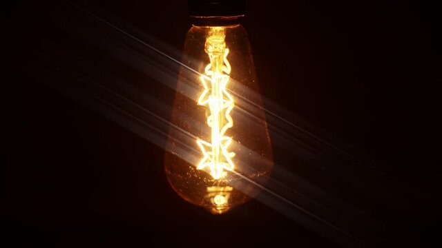 The light turns on. Edison light bulb reproduction.