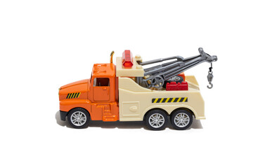 Toy tow truck on a white background. Children's car for transporting cars.
