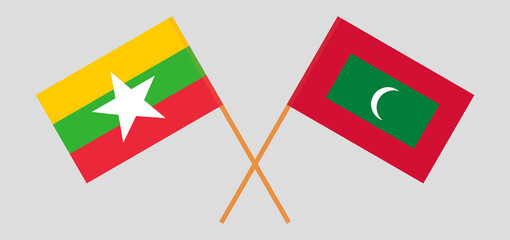 Crossed flags of Myanmar and Maldives. Official colors. Correct proportion