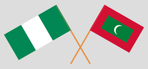 Crossed flags of Nigeria and Maldives. Official colors. Correct proportion