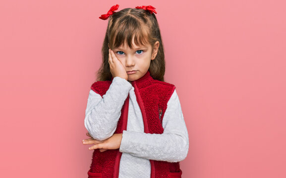 Little caucasian girl kid wearing casual clothes thinking looking tired and bored with depression problems with crossed arms.