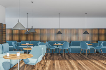 Modern cafe interior with wooden tables and blue chairs with sofa