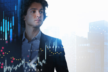 Portrait of handsome businessman in black suit looking at downto