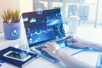 Businesswoman hand with laptop screen, hud hologram with lock and icons
