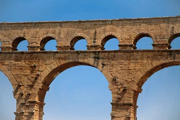 Papier Peint photo autocollant Pont du Gard Pont du Gard, Gard, Occitanie, France: Roman aqueduct over Gardon river: close-up detail of top tier of arches