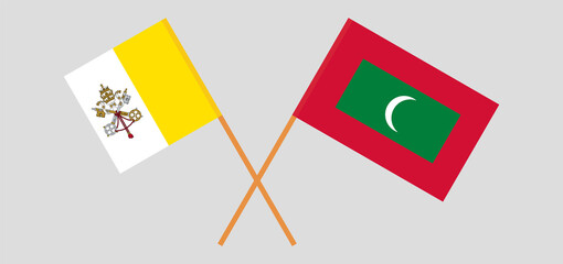 Crossed flags of Vatican and Maldives. Official colors. Correct proportion