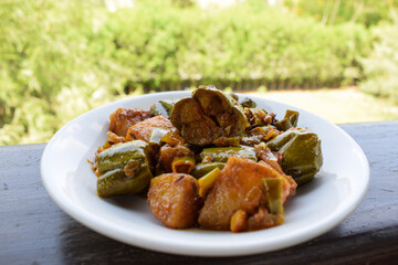 Parwal aloo ki sabji also known as Pointed gourd and potato fry curry. Tasty home made side dish made dhaba style it is authentic Indian curry