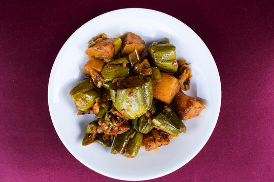 Parwal aloo ki sabji also known as Pointed gourd and potato fry curry. Tasty home made side dish made dhaba style it is authentic Indian curry