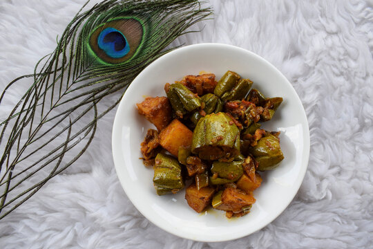 Parwal aloo ki sabji also known as Pointed gourd and potato fry curry. Tasty home made side dish made dhaba style it is authentic Indian curry