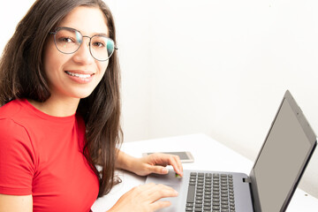 Colombian girl next to the laptop at home